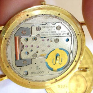 an open case-back of a quartz watch